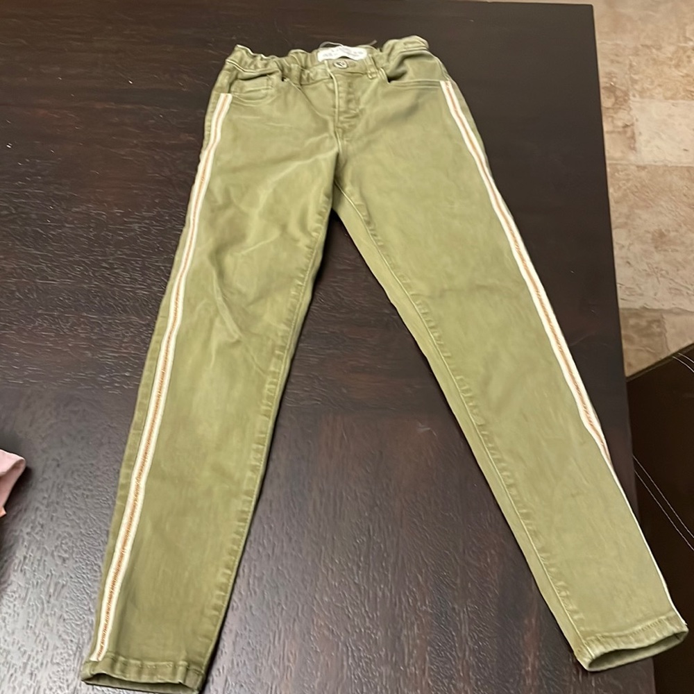 Very cute green pants with fancy stripe on the side.  No stains.  7-8 size.